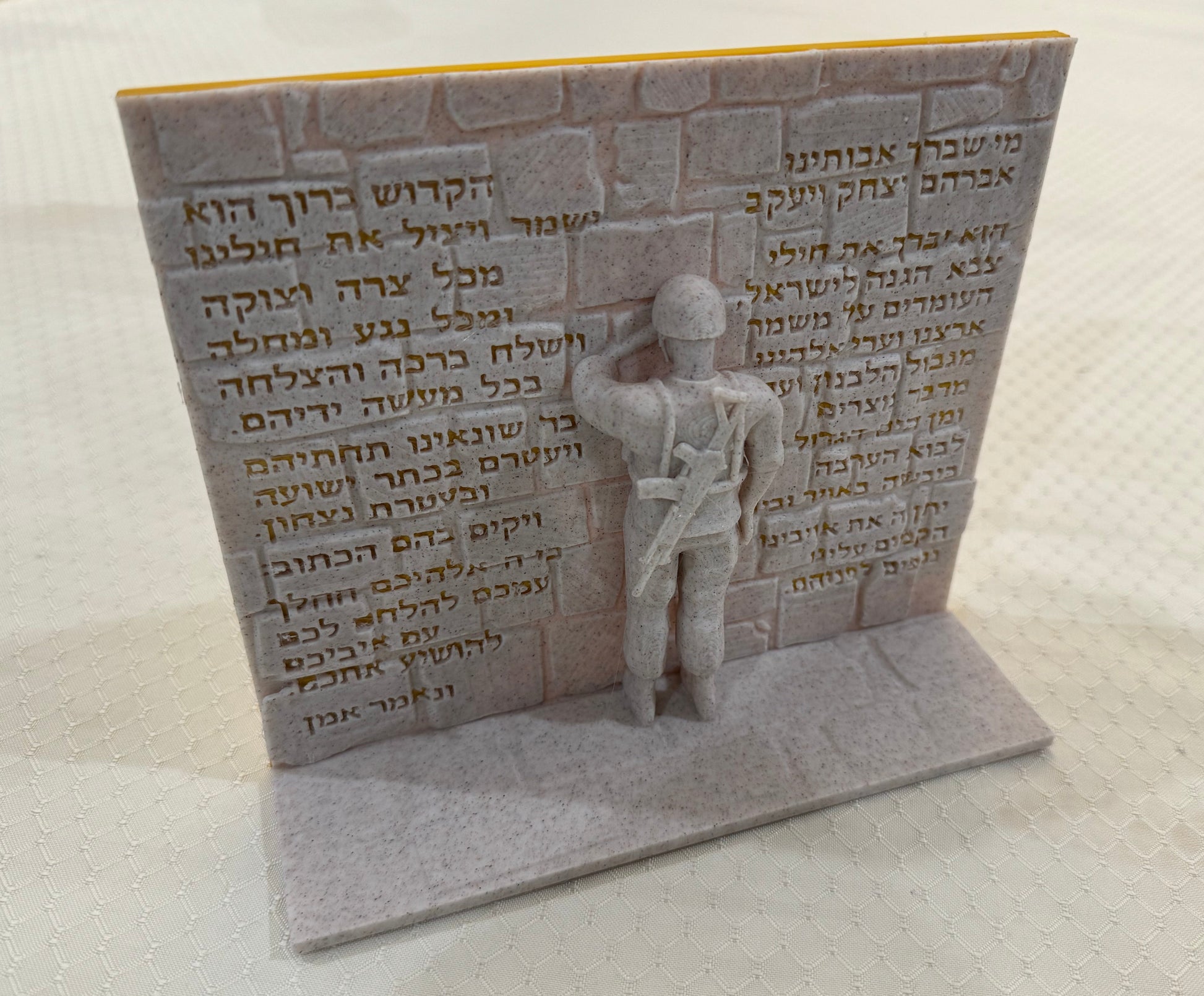 Large figurine in faux stone and gold.